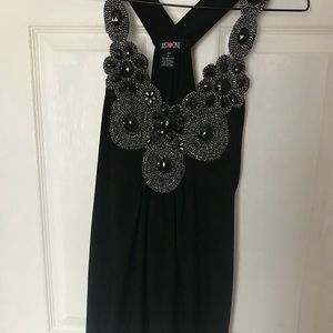 Black top with embellishments.